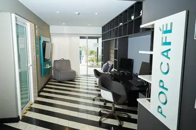 an office with a desk and chairs and a computer at Beautiful cozy Apt Barranco / Miraflores Peru in Lima