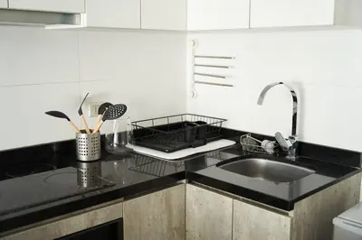 a kitchen with a sink and a counter top at Beautiful cozy Apt Barranco / Miraflores Peru in Lima