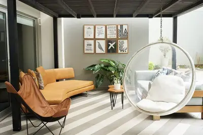 a living room with a chair and a mirror at Beautiful cozy Apt Barranco / Miraflores Peru in Lima