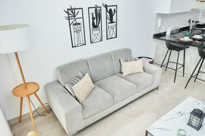 a living room with a couch and a table at Beautiful cozy Apt Barranco / Miraflores Peru in Lima