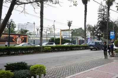 two people standing on a sidewalk next to a street at Beautiful cozy Apt Barranco / Miraflores Peru in Lima