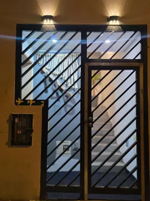 an open door to a stairway with a glass window at Sabina aeropuerto hostel in Lima