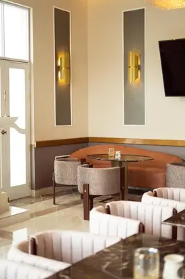 a restaurant with tables and chairs and a tv at Hotel de Turistas Huancayo - Hotel Asociado Casa Andina in Huancayo
