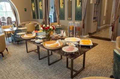 a living room with a table with food on it at Hotel de Turistas Huancayo - Hotel Asociado Casa Andina in Huancayo