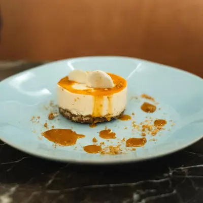 a piece of dessert on a plate on a table at Hotel de Turistas Huancayo - Hotel Asociado Casa Andina in Huancayo