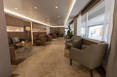 a waiting room with couches and chairs in a lobby at Hotel Presidente Huancayo - Asociado Casa Andina in Huancayo
