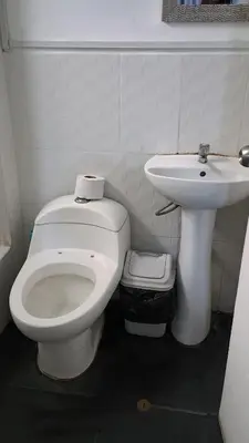 a bathroom with a toilet and a sink at Residencial Salamanca in Lima