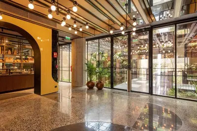 a large lobby with large windows in a building at Doubletree By Hilton Lima San Isidro in Lima