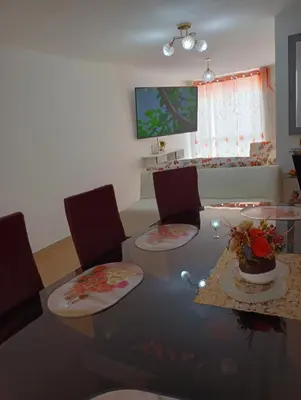 a living room with a glass table and chairs at lindo departamento Frente al mar in Lima