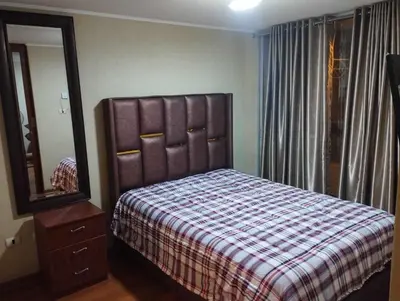 a bedroom with a bed and a dresser and a mirror at Apartment near to MIRAFLORES, BEACHES & REBAGLIATI HOSPITAL ! Panoramic View,Pool, Gym,Private Park in LINCE in Lima