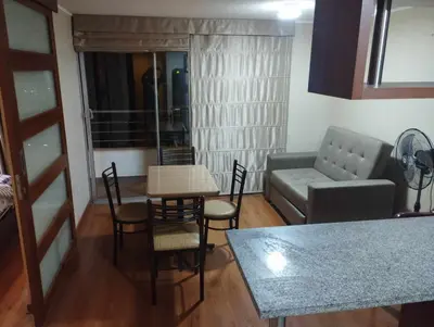 a living room with a couch and a table and chairs at Apartment near to MIRAFLORES, BEACHES & REBAGLIATI HOSPITAL ! Panoramic View,Pool, Gym,Private Park in LINCE in Lima