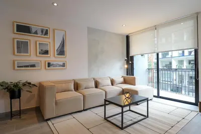 a living room with a couch and a table at Caster by Wynwood House in Lima