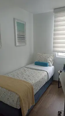 a bedroom with a bed and a window at Vive y trabaja con estilo en San Miguel, moderno departamento de 2 dorms con balcon in Lima