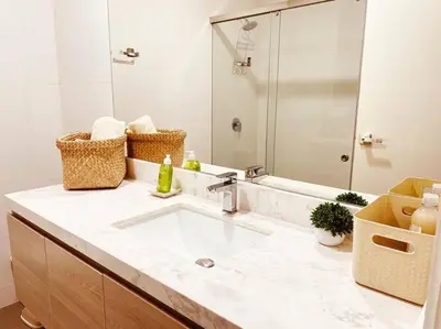 a bathroom with a sink and a large mirror at Sky1004 in Lima