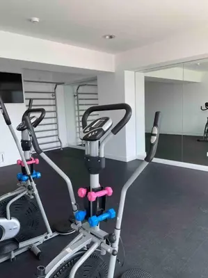 a gym with two exercise bikes in a room at Sky1004 in Lima