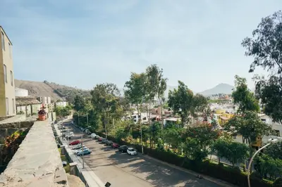a view of a city street with cars parked at Acogedor departamento con amplia terraza in Lima