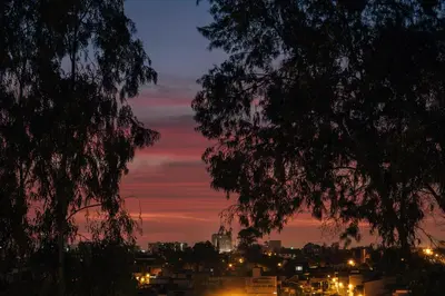 a view of a city at night at Acogedor departamento con amplia terraza in Lima