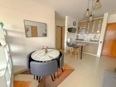 a kitchen and dining room with a table and chairs at Departamento en el corazón de Miraflores in Lima