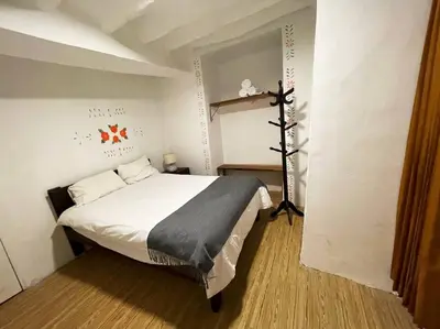 a bedroom with a large bed in a room at Casa Justina in Cusco