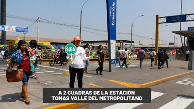 a man holding a stop sign in the street at Hospedaje Escorpio in Lima
