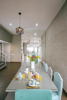a dining room with a table with food on it at Mar y campo Casa Huarca in La Isla