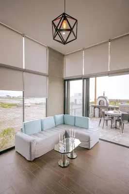 a living room with a couch and a table at Mar y campo Casa Huarca in La Isla