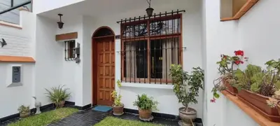 a front door of a house with potted plants at Casa Huaca in Lima
