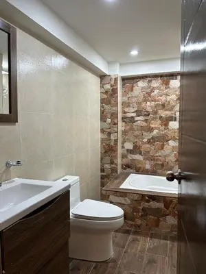 a bathroom with a toilet and a bath tub at Skyhousecusco in Cusco