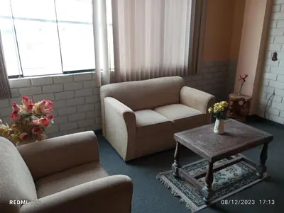 a living room with two chairs and a coffee table at Alojamiento Punta Negra in Punta Negra