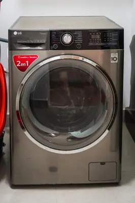 a washing machine is sitting on the floor at Apartamento de Ensueño LINCE in Lima