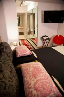 a living room with a couch and a television at Chic Miraflores AC HEATER 16th floor in Lima