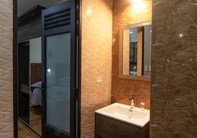 a bathroom with a sink and a mirror at Hotel Precursores in Lima