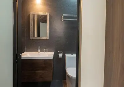 a bathroom with a sink and a toilet at Hotel Precursores in Lima