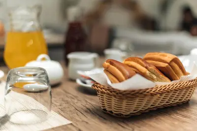 a basket of hot dogs on a table at Escobedo’s Inn Machupicchu in Machu Picchu