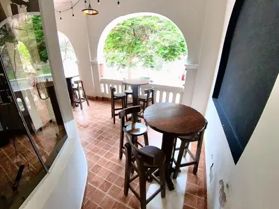 a group of tables and stools in a room at El Boulevard de Huacachina in Ica
