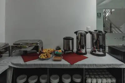 a counter with two kettles and a bowl of food at Classic Hotel Cusco in Cusco