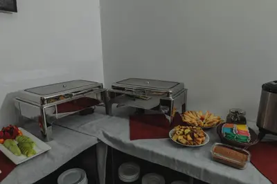 a kitchen with two stoves and food on a counter at Classic Hotel Cusco in Cusco