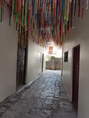 a hallway with colorful streamers hanging from a ceiling at Qosqo Apartments 3 in Cusco