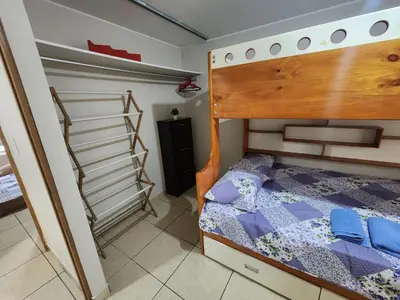 a bedroom with a bunk bed and a staircase at rodrich business apartment in Lima