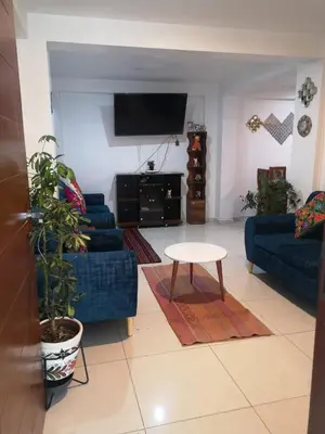 a living room with a couch and a table at Encanta Perú Apartment in Cusco