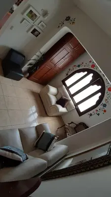 a living room with a couch and a window at Pretty House Hotel in Lima