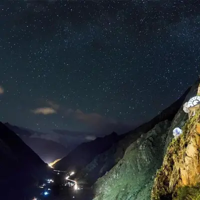 a starry night with a view of a mountain at Skylodge Adventure Suites in Urubamba