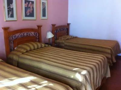 a hotel room with two beds in a room at Oro Viejo in Nazca
