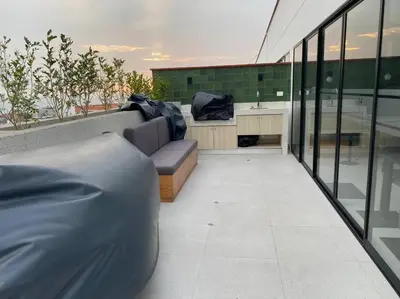 a balcony with a couch and a sink on a building at Apartamento en Barranco in Lima
