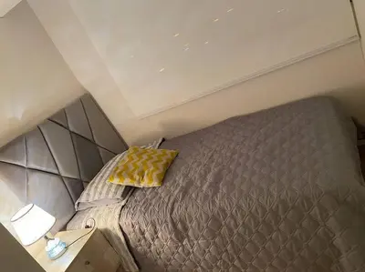 an overhead view of a bed in a small room at Apartamento en Barranco in Lima