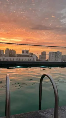 a swimming pool with a view of a city at Apartamento en Barranco in Lima