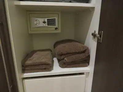 a bathroom with towels on shelves in a room at Spacious Apartment in Miraflores in Lima