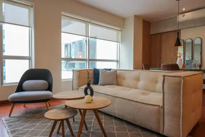 a living room with a couch and two chairs at Narciso 350 by Wynwood House in Lima