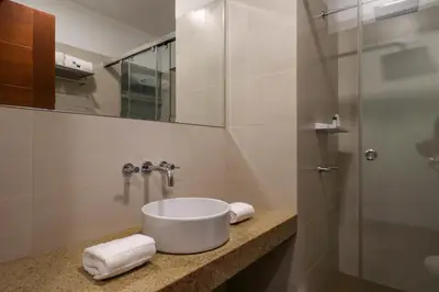 a bathroom with a sink and a shower at Narciso 350 by Wynwood House in Lima