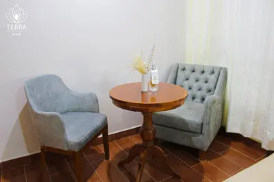 a room with a table and two chairs and a table and chair at Terra Premium Hotel in Huánuco